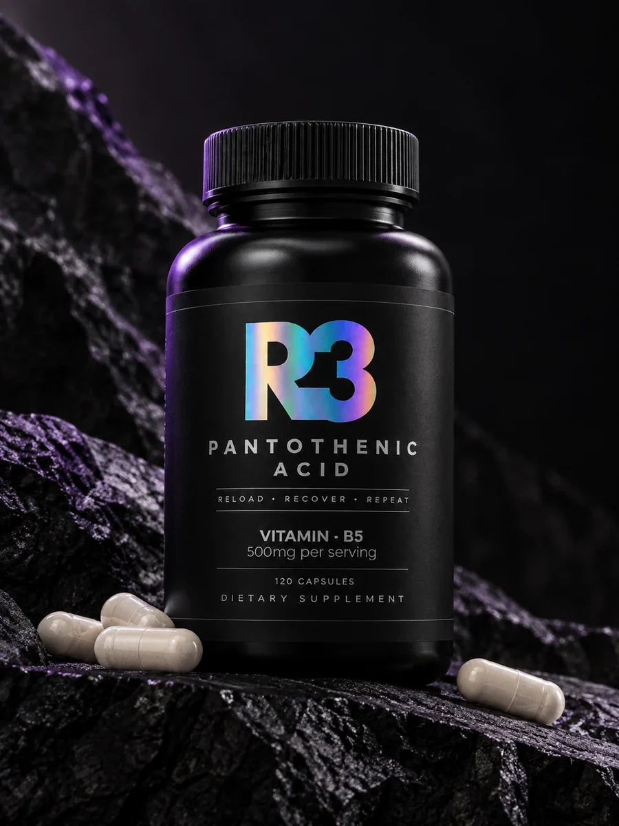 Pantothenic Acid bottle and capsules on dark rock, representing the product in an energy-metabolism story