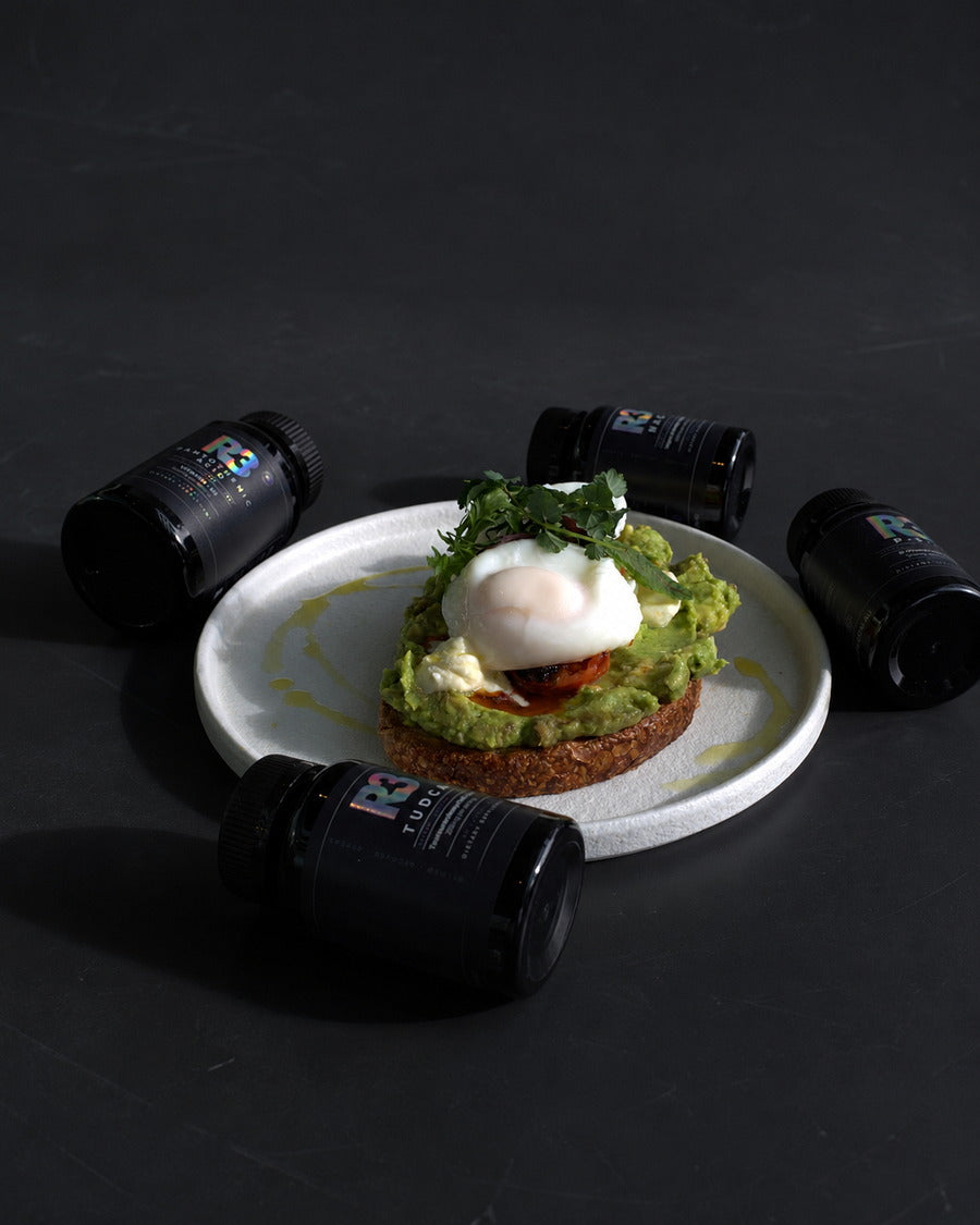 R3 supplement bottles beside cafe avocado toast in a premium daily routine scene