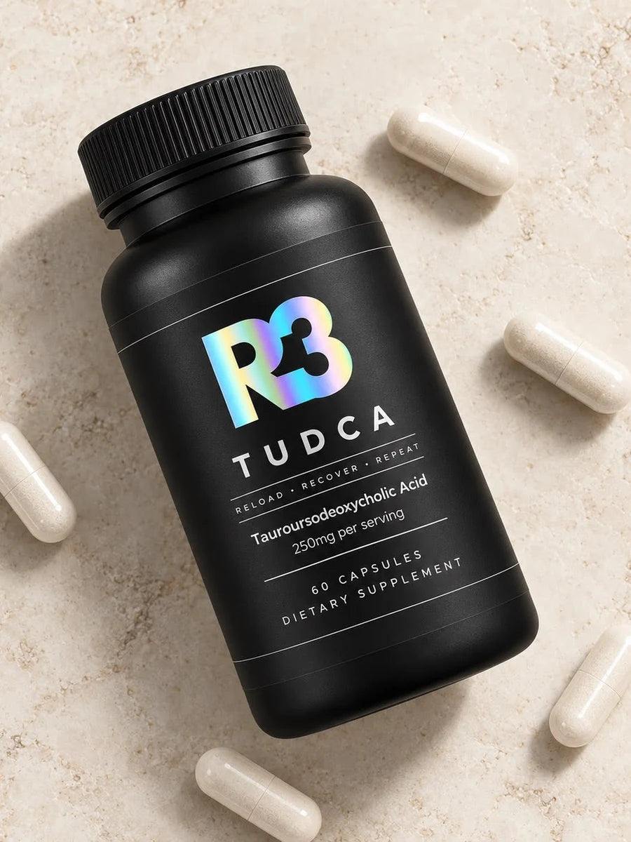 R3 TUDCA bottle lying on stone with capsules